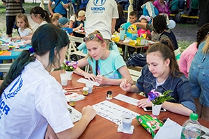 Teen girls in Zaporizhia, Ukraine participate at a calligraphy workshop