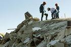 International rescue team workers in an effort to recover survivors in Port-au-Prince, Haiti
