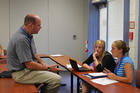 Dr. Peter Howard (left) chats with some Washington Community of Scholars students in summer 2009.