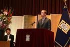 Eric Jensen, a dual degree student, gives a welcome speech in Japanese at the opening of classes at Ritsumeikan University.