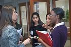 Kogod alumna Raluca Monetchats with grad students about her work as an operations analysis manager at Unisys Global Industries.