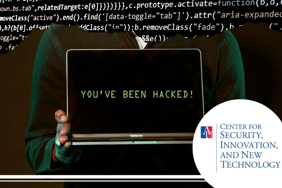 Individual holding a computer reading - you've been hacked, with code in the background.