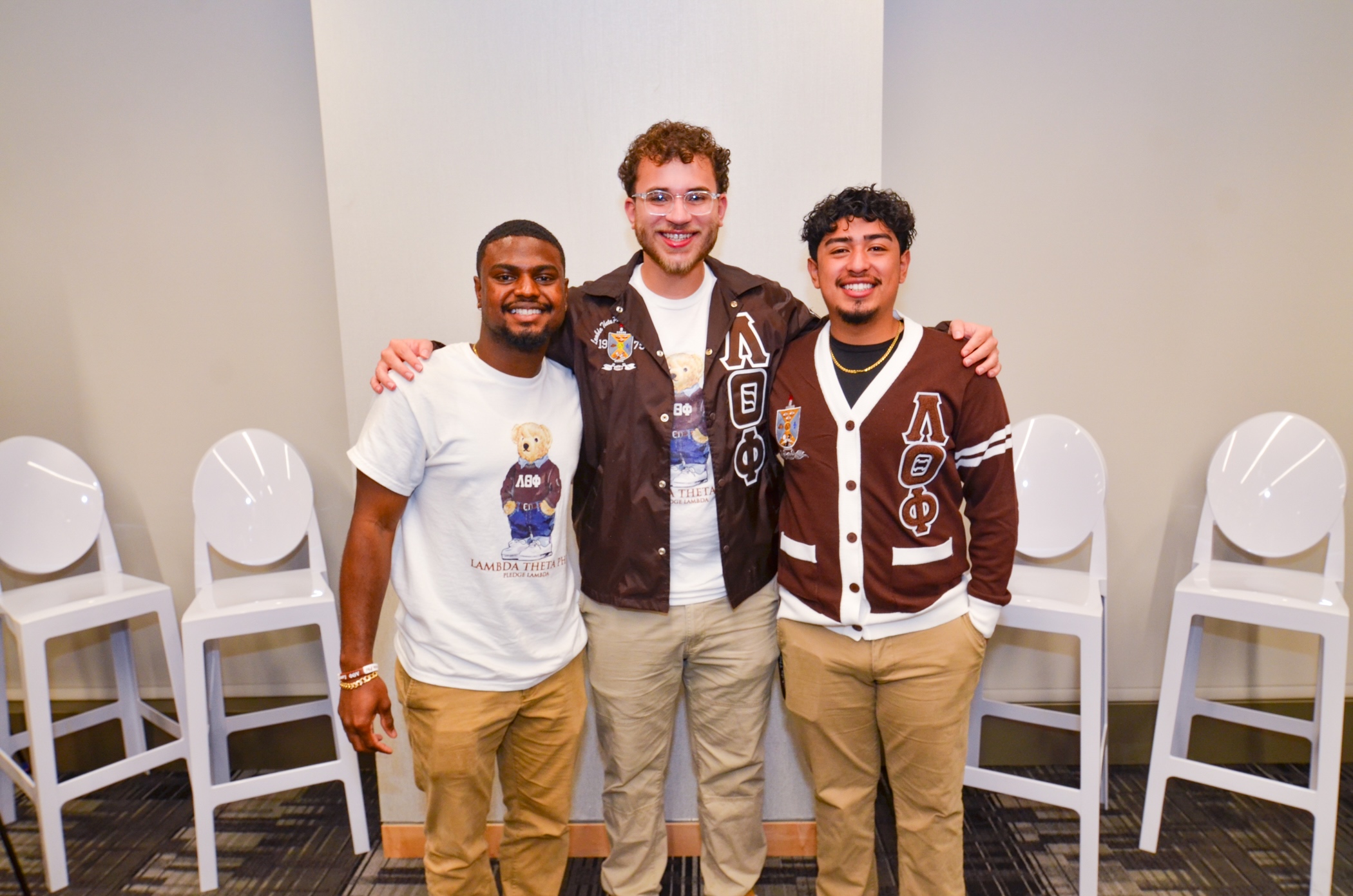 54054848086_139d071364_o (1) Three alumni at an event.