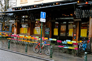 Colorful chairs on the patio of a cafe