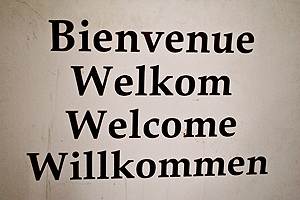 A sign saying Welcome in four different languages