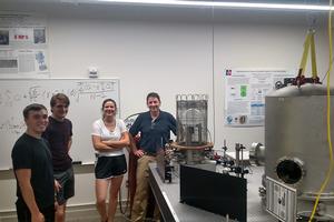 Students Maya Kinley-Hanlon, David Bialy, and Jacob Vancampen with Philip Johnson in AU’s gravitational wave detector lab.