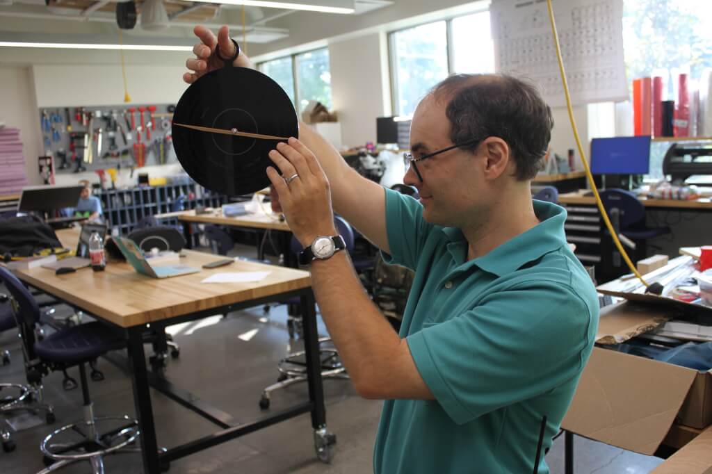 Michael Robinson looks through his new astrolabe