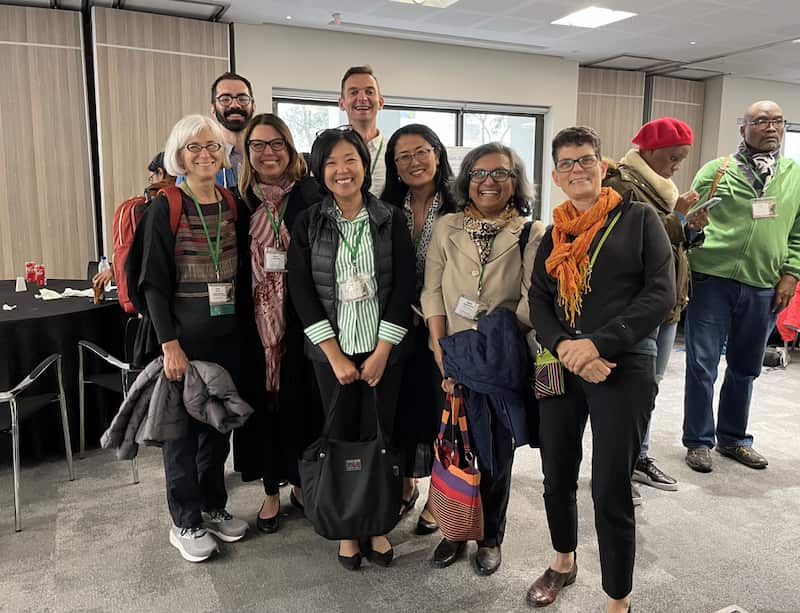 AU PhD grads and faculty reunite at IAFFE 2023 in Cape Town, South Africa.