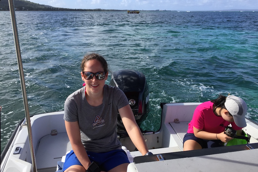 Alex Morris driving the boat used to collect water, seagrass, and algae samples from the reef.