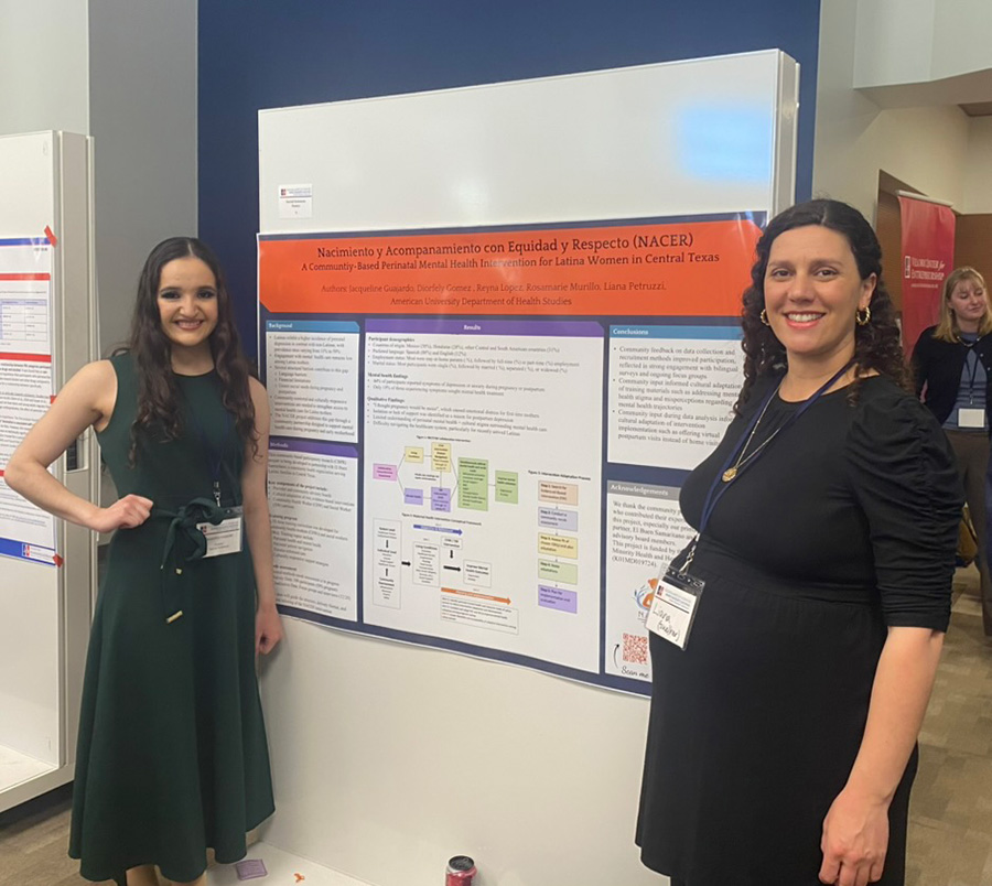 Jacqueline and Liana in front of Jacqueline's poster 