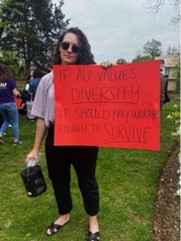 Carmen Bolt with sign reading "If AU values diversity, it should pay workers enough to survivie"