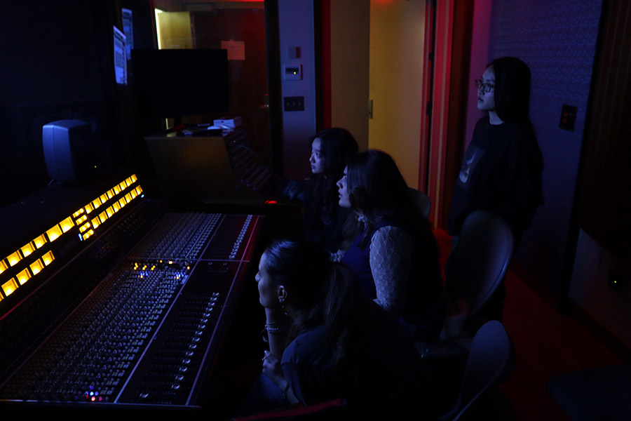 Members of Women in Audio in the recording studio