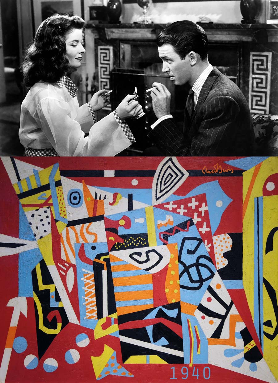 Still from The Philadelphia Story of a woman lighting a man's cigarette in front of a fireplace with Greek tile motif alongside colorful abstract geometric painting with similar black-and-white striped elements. 
