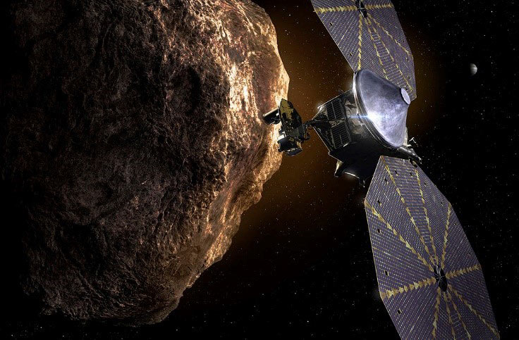 Illustration: The Lucy spacecraft passing one of the Trojan asteroids near Jupiter