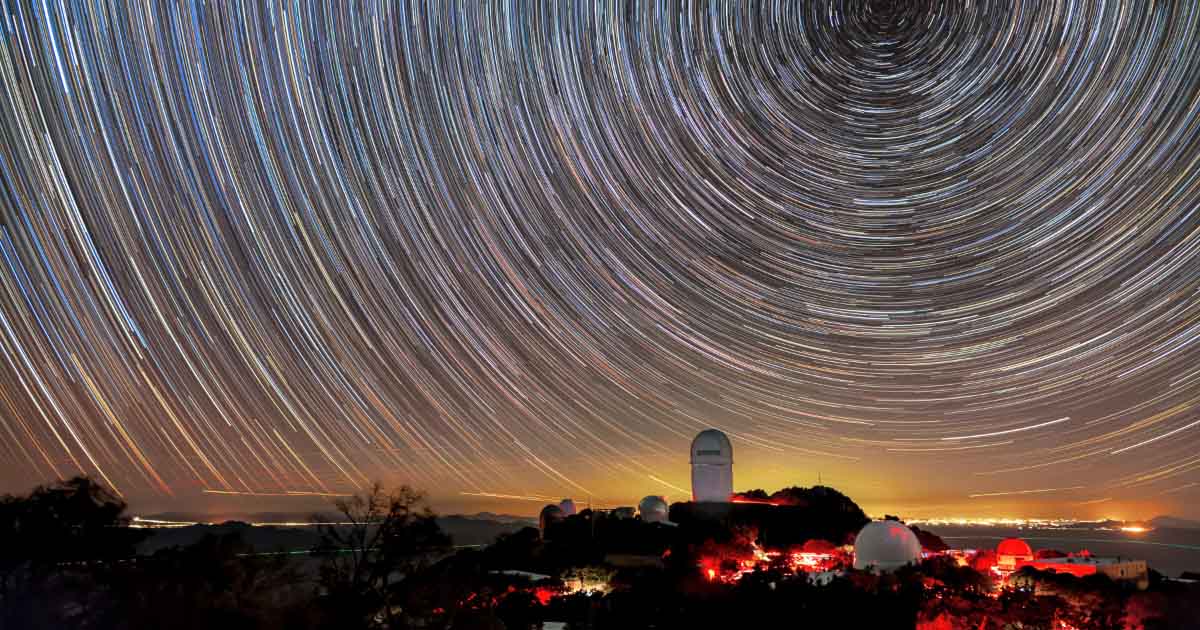 Mayall Telescope, shown beneath star trails captured in a long-exposure image.   Credit: KPNO/NOIRLab/NSF/AURA/B. Tafreshi 