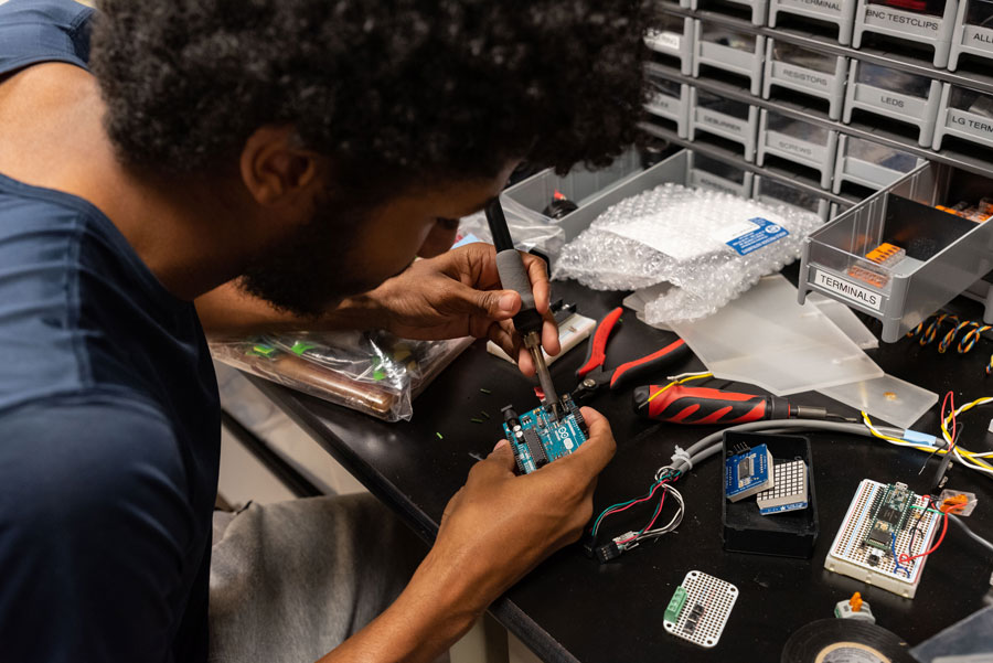 Student works on circuit board