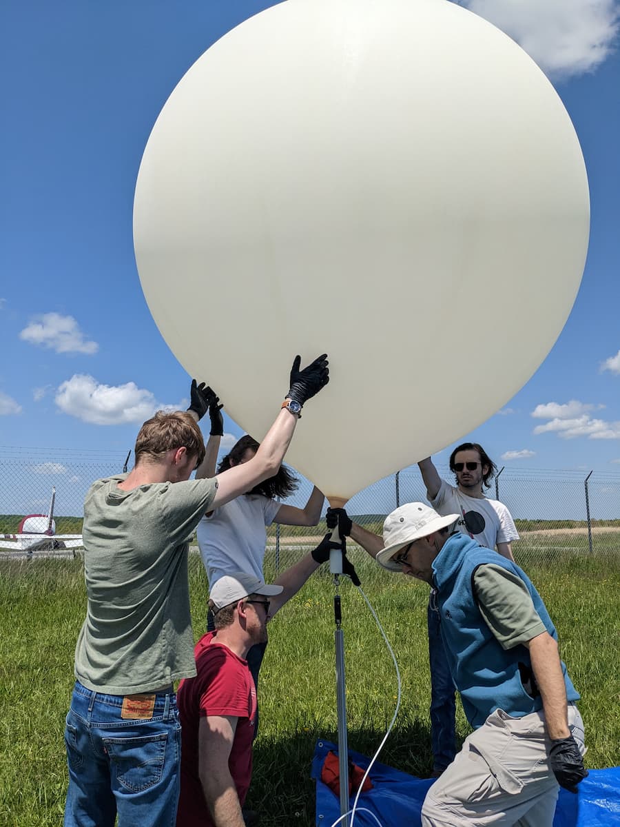 Team prepares balloon for launch. 