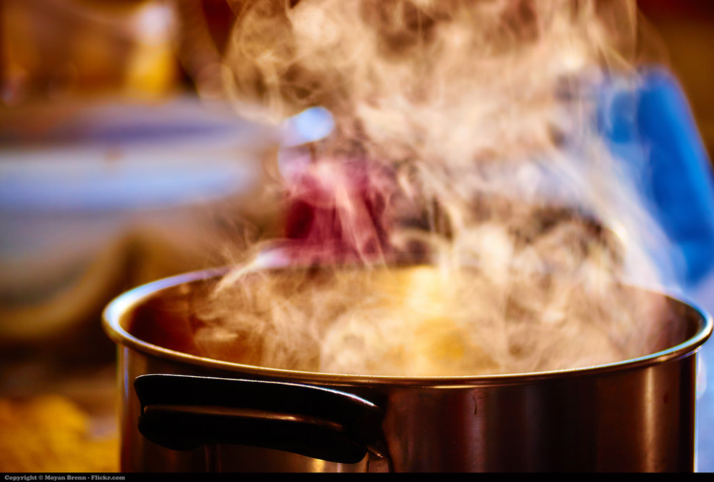 A copper pot boiling