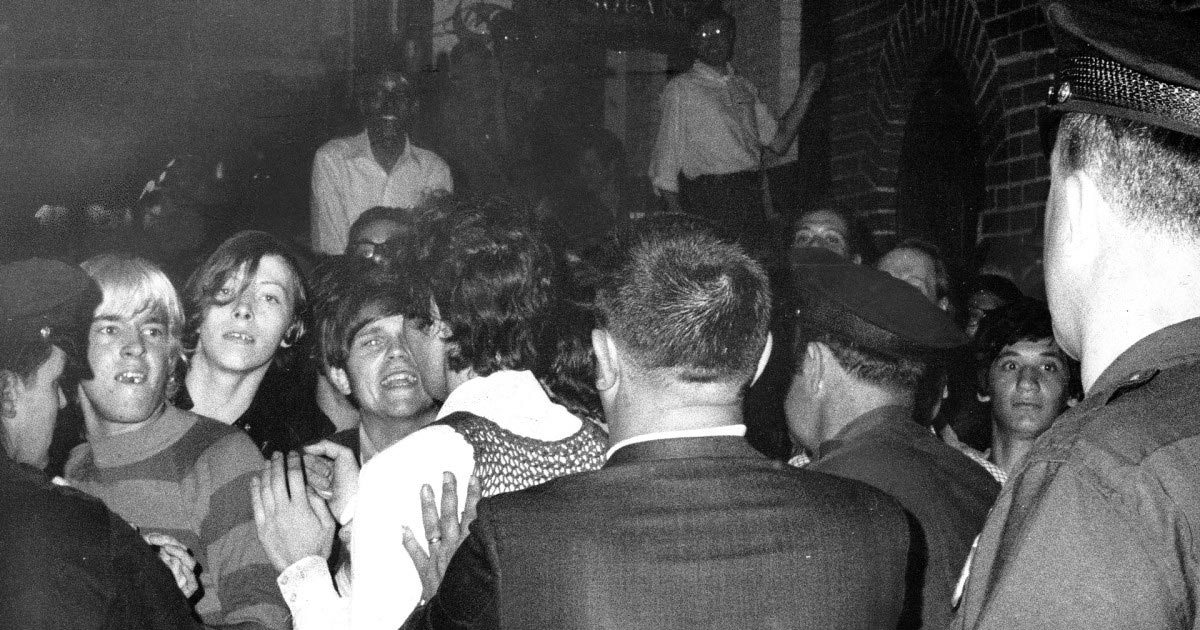 Police force people back outside the Stonewall Inn as tensions escalate the morning of June 28, 1969. Photographer: Joseph Ambrosini of the New York Daily News.