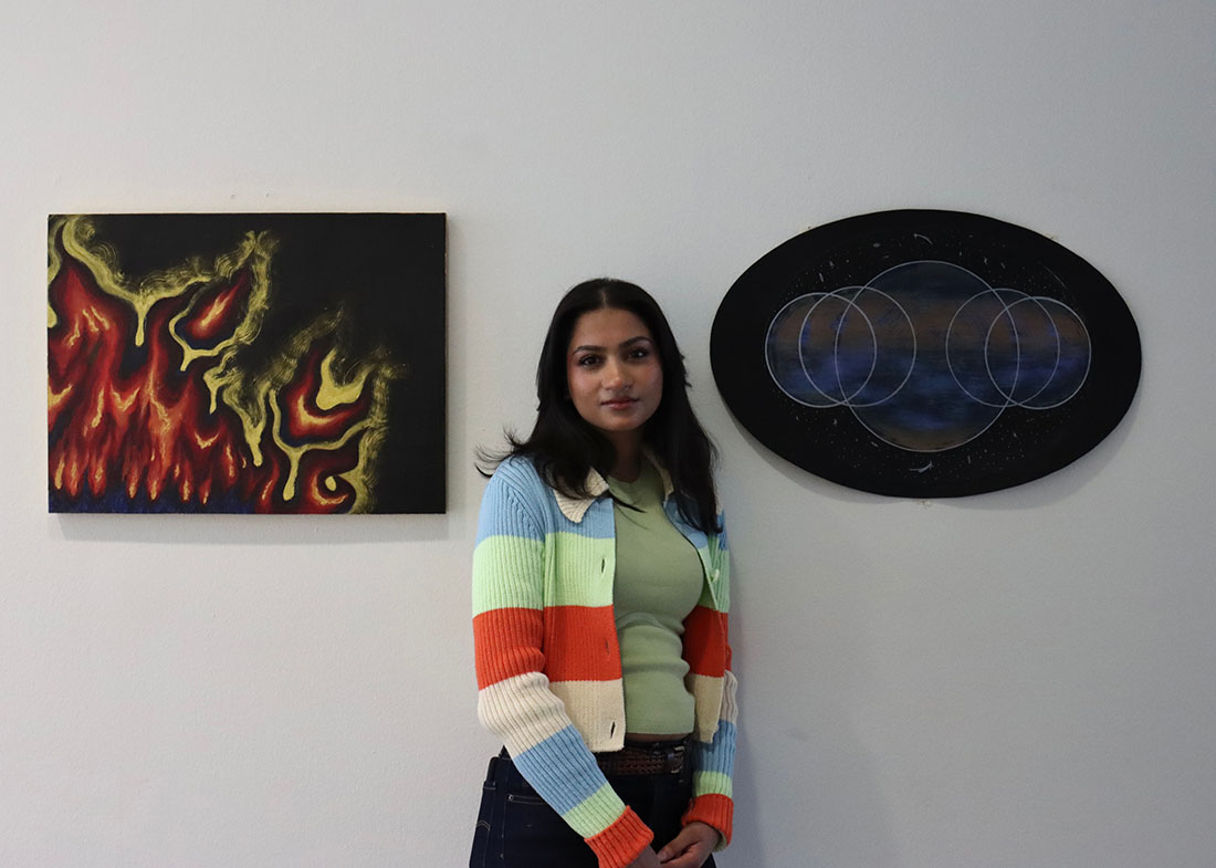 Alisha Rao with paintings: stylized flames, overlapping circles