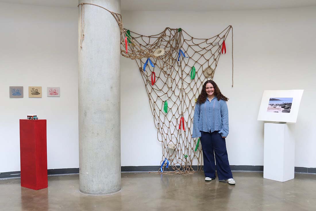 Carolina Cohen with artwork: prints, sculpture, and fishing net installation