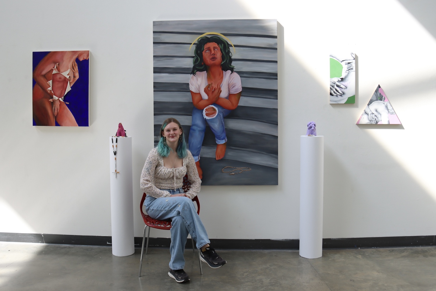 Miranda Braemer with paintings and sculptures