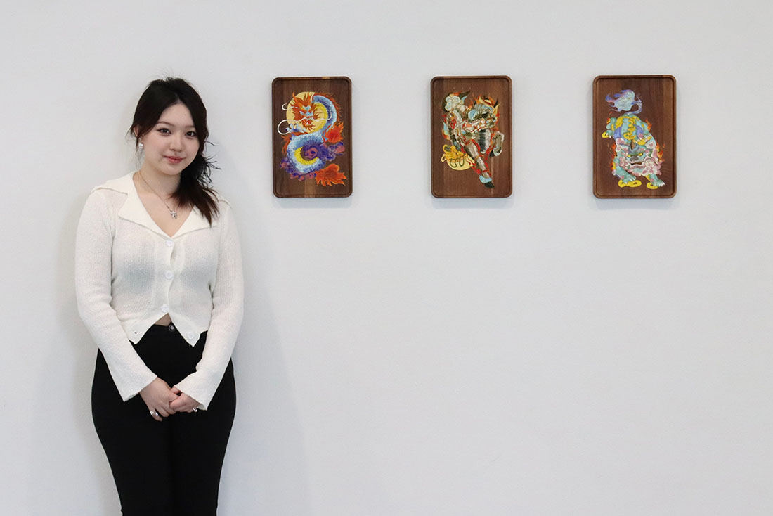 Luojie Bin with artwork: dragon sculptures on wood