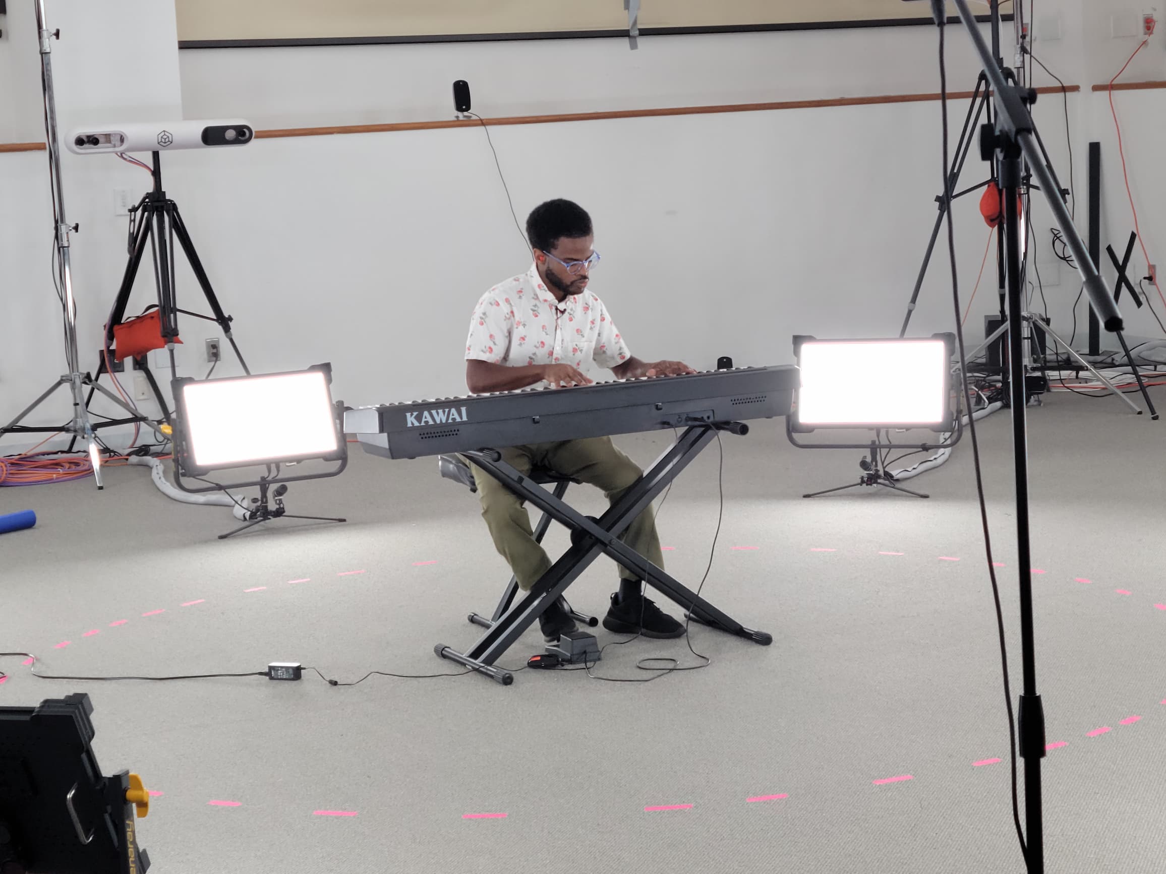 One person plays keyboard in a volumetric capture studio