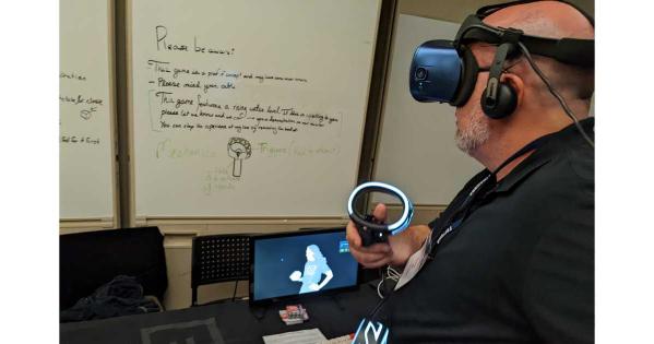 A person interacts with a VR experience while wearing a headset and operating a set of controllers