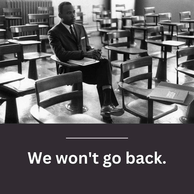 James Meredith seated in a classroom: We won't go back.