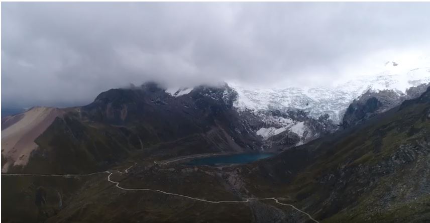 A glacier in Peru under heavy clouds
