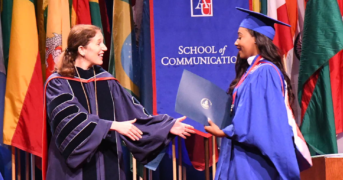 Student receiving diploma at graduation