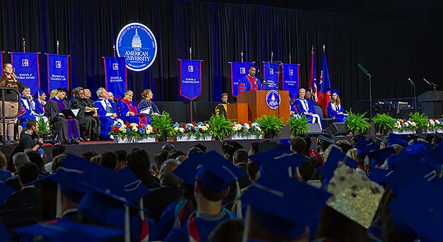 Photo of student speaker giving remarks at AU commencement
