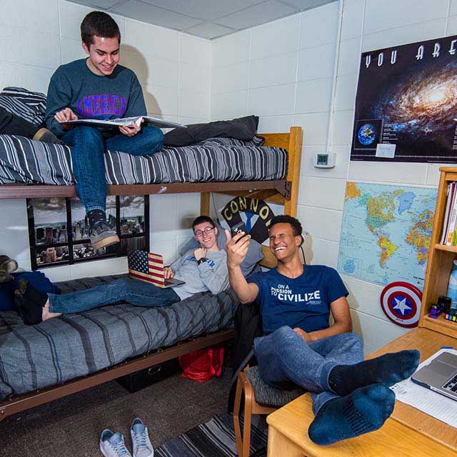 Students relax in their room in Letts Hall.