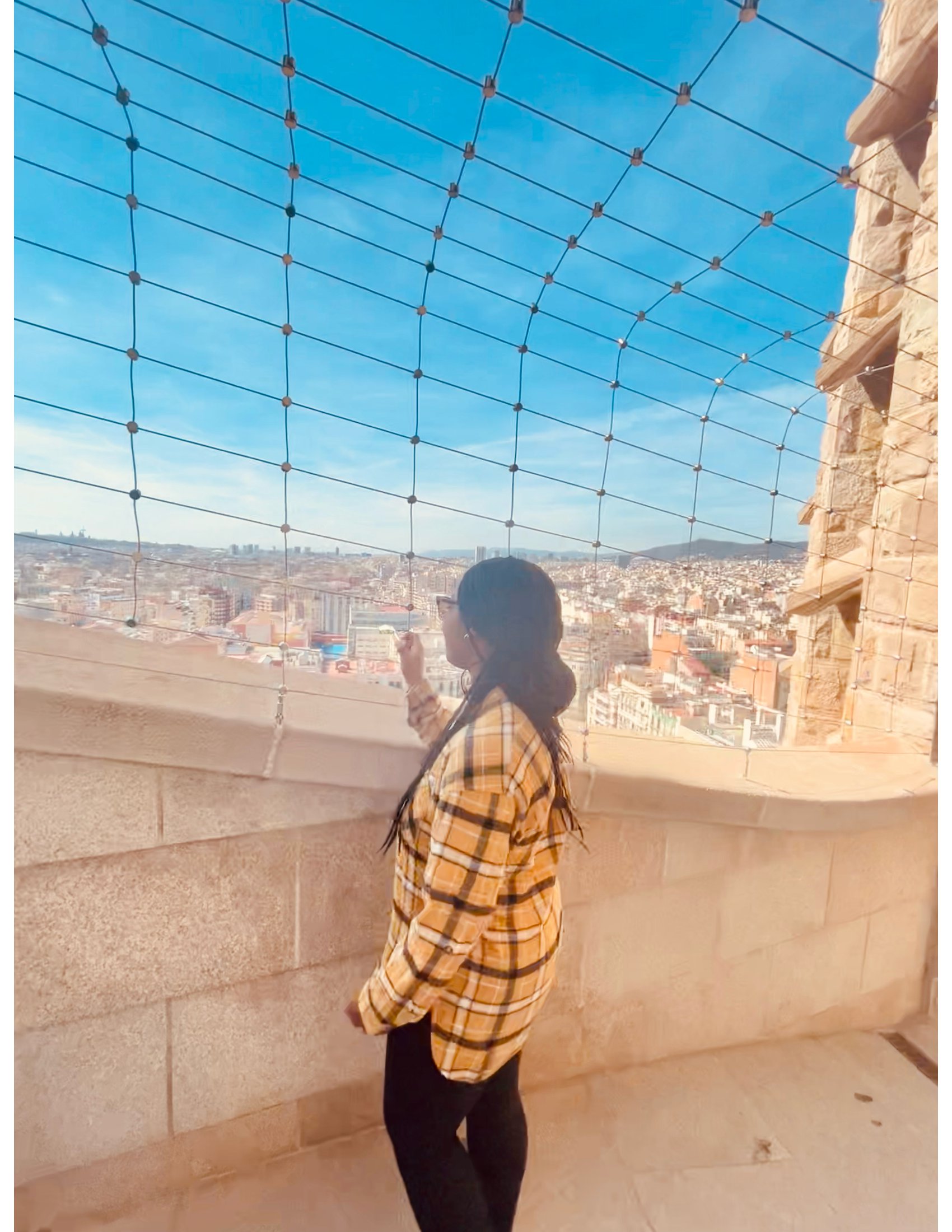 person looking out over barcelona