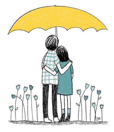 couple hugging under a yellow umbrella