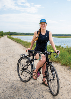 Kristine Keeney riding a bike along the Eastern Trail