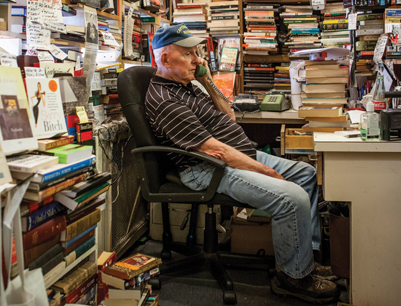 Jim Toole at the front desk at Capitol Hill Books