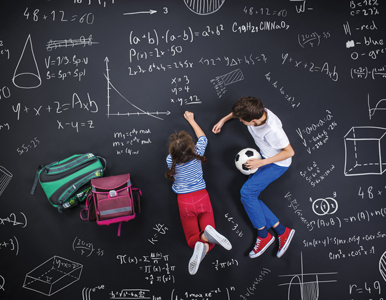 kids doing math problems on a chalkboard