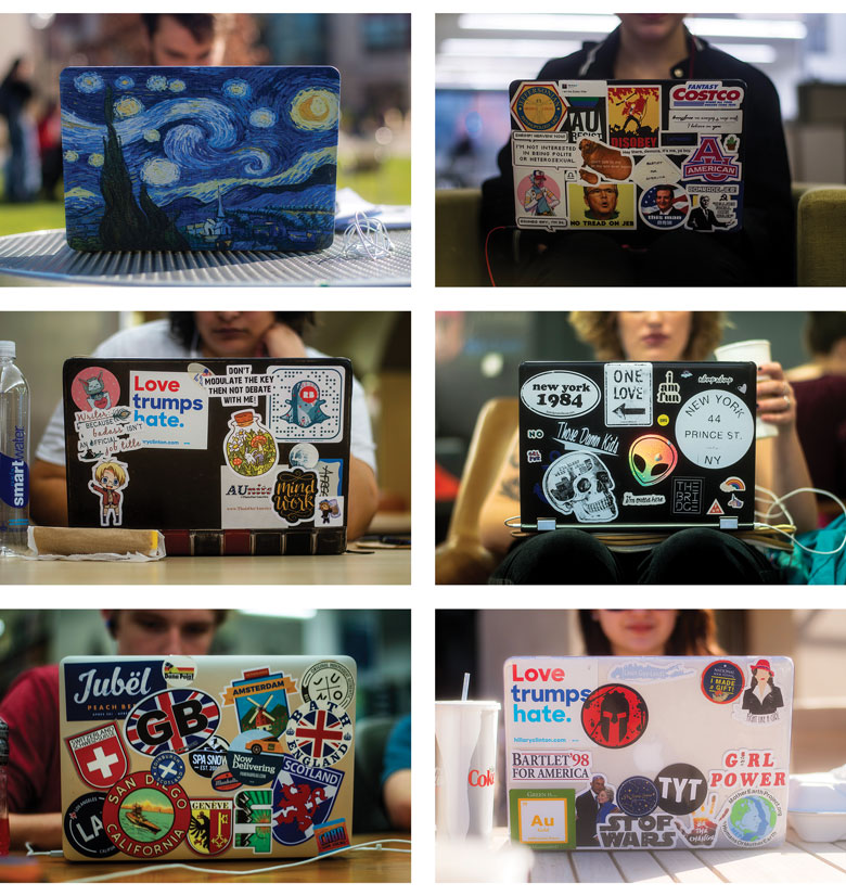 six laptops with an array of decorative stickers
