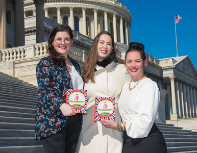 Three staffers from She Should Run on the steps of the US capitol