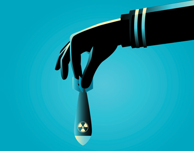illustration of hand holding a nuclear warhead