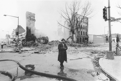 Man walks through devastated neighborhood after the 1968 riots