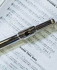 flute on top of sheet music
