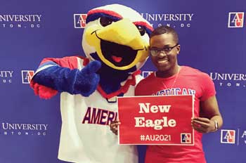 admitted student poses with Clawed the Eagle