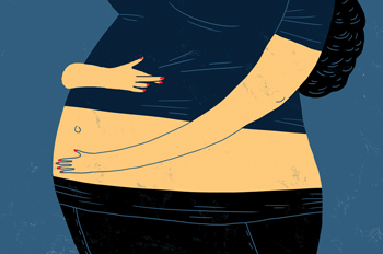 pregnant woman cradling her belly and crossing her fingers