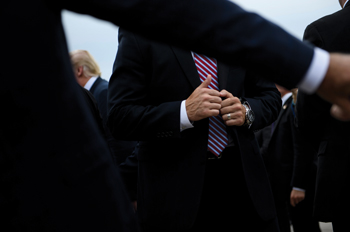 Secret Service agent stands ready as President Donald Trump walks past