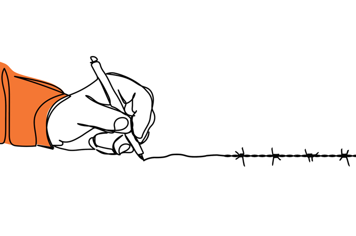 hand drawing a line with barbed wire