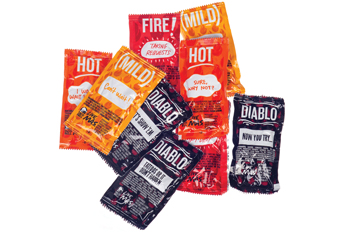 Pile of Taco Bell hot sauce packets