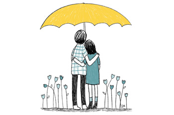 couple hugging under a yellow umbrella